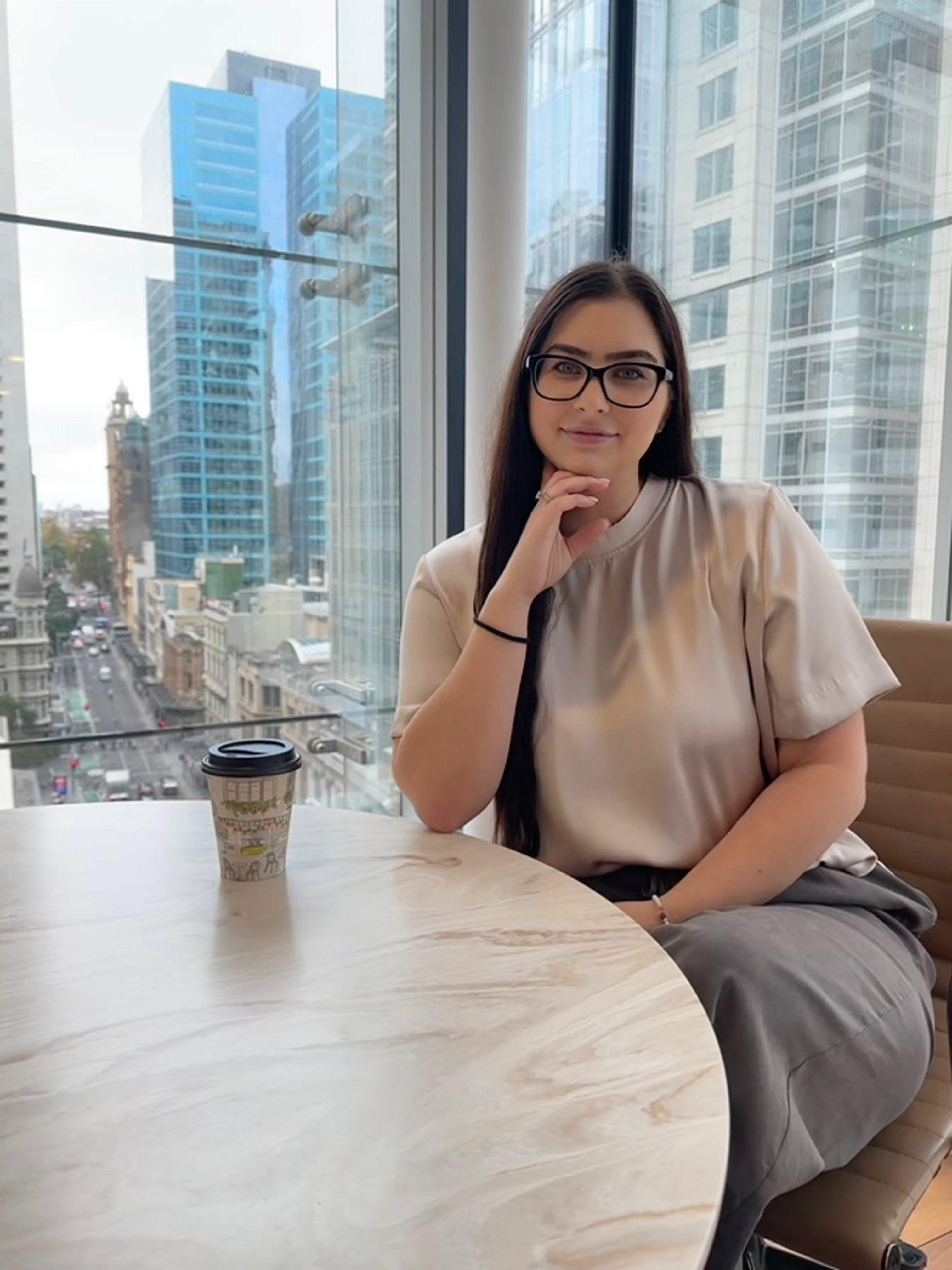 female sitting at office desk in sydney CBD